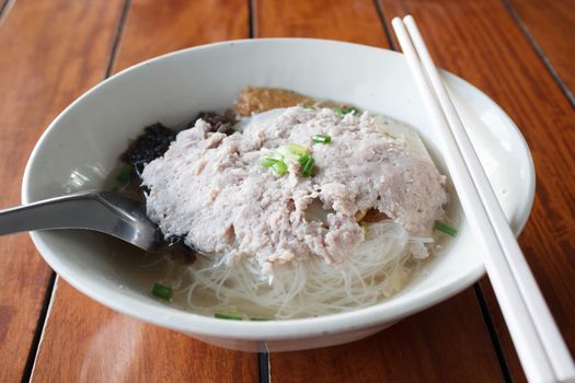 rice noodles soup with vegetables and pork