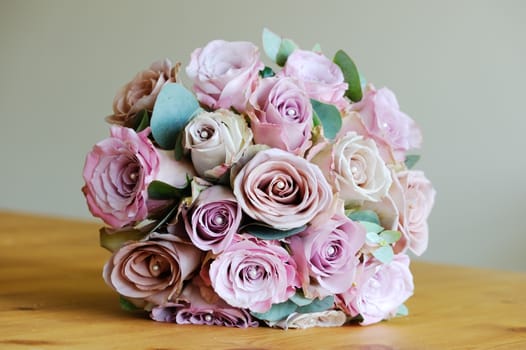 Brides bouquet of pink roses on wedding day