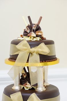 Chocolate wedding cake details at reception venue