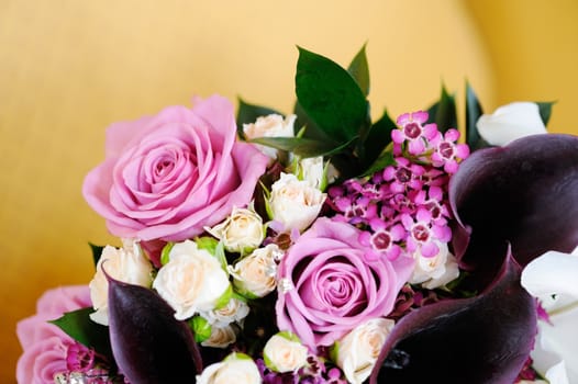 Closeup detail of brides pink flowers on wedding day
