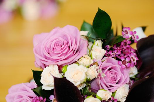 Detail of brides bouquet of pink roses on wedding day