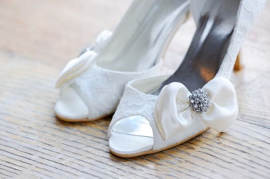 Brides white shoes closeup on wedding day