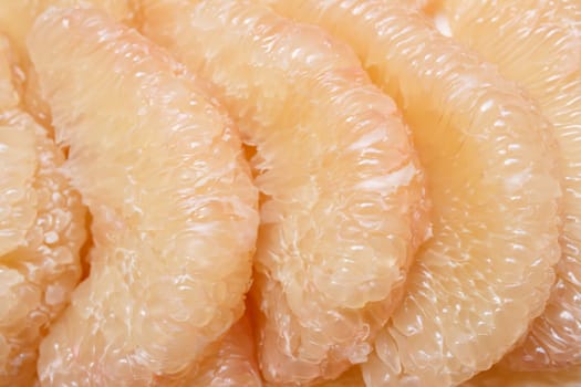 close up peeled pomelo pieces fruit