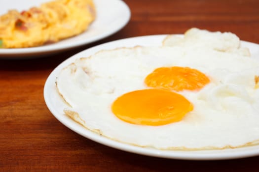 Close up Fried Eggs on Wooden Table