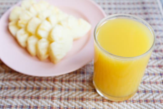 glass of Pineapple juice on mat