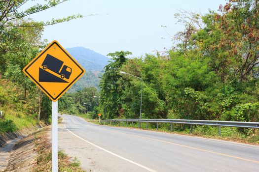 Steep grade hill ahead warning roadsign, steep descent ahead