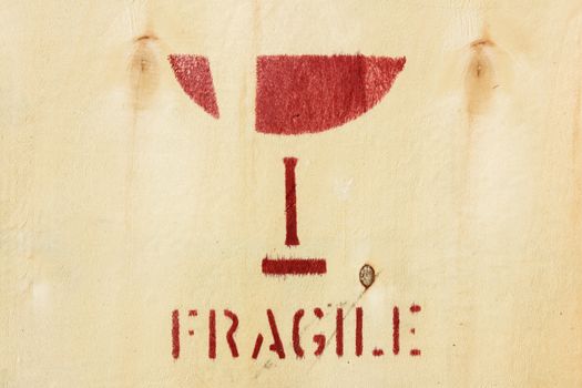 red fragile symbol on wooden box