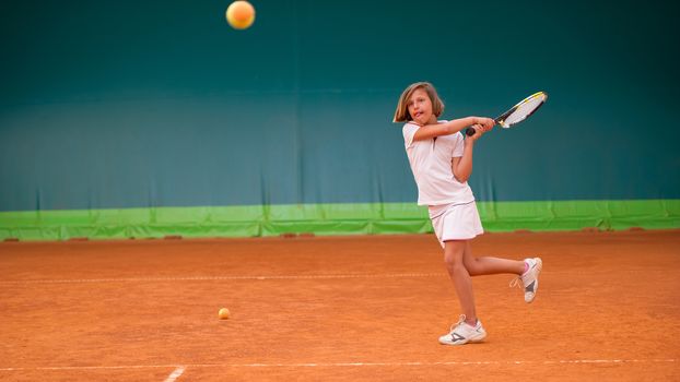 Children at school during a dribble of tennis