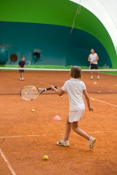 Children at school during a dribble of tennis