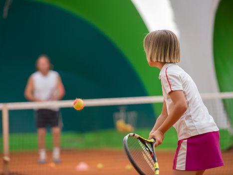 Children at school during a dribble of tennis