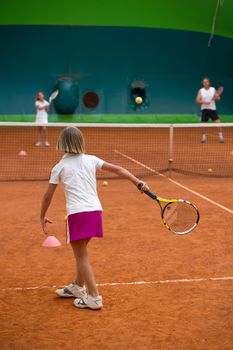 Children at school during a dribble of tennis