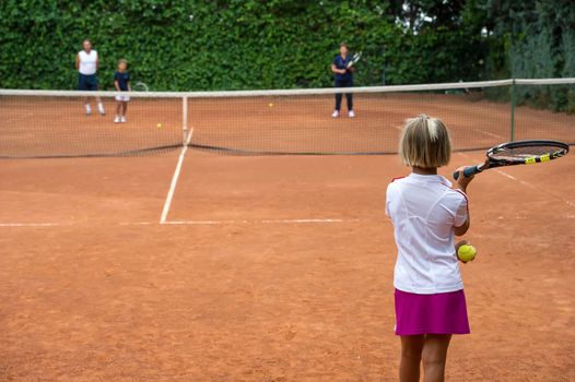 Children at school during a dribble of tennis