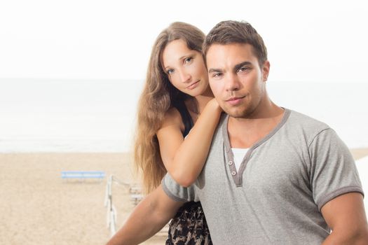 Summer, sea. Attractive couple on the beach