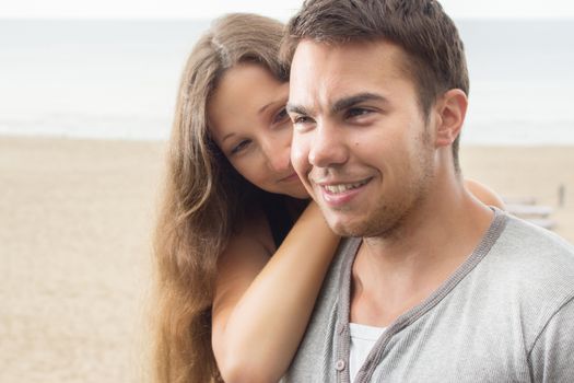 Summer, sea. Attractive couple on the beach