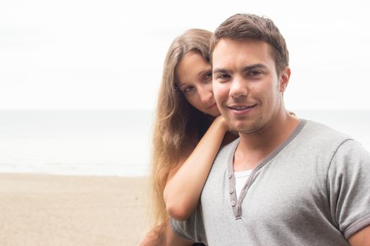 Summer, sea. Attractive couple on the beach