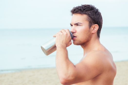 Lifeguard, summer. Handsome man on the beach