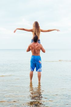 Summer, sea. Attractive couple on the beach