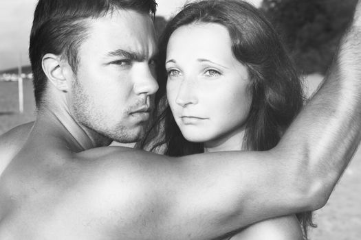 Summer, sea. Attractive couple on the beach