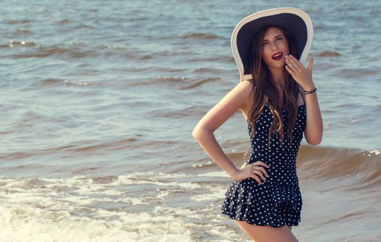 Beauty, summer. Cute, attractive woman on the beach