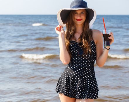 Beauty, summer. Cute, attractive woman on the beach