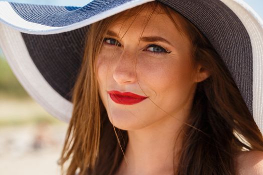 Beauty, summer. Cute, attractive woman on the beach