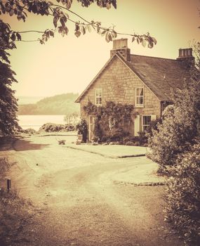 Retro Sepia Styled Photo Of Idyllic Remote Cottage By The Sea