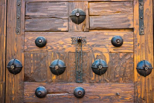 Detailed view of ancient door with beautiful iron fitting decoration