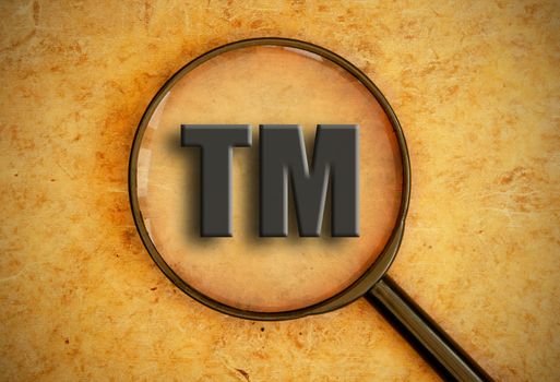 Magnifying glass focusing on trademark sign