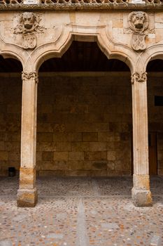 Detail capture showing the complex odd shape archery of the cloister in the Patio de Escuelas Menores in old Salamanca University buildings, Spain