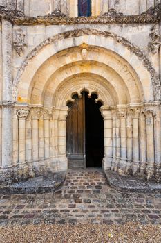 View of main entrance door with archivolts and columns in Petit Palais et Cornemp romanesque chruch in  in the Gironde department of France