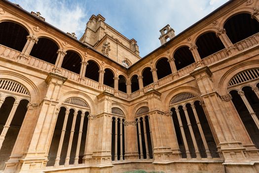 Detail view of lower and upper archery of the cloister from San Esteban dominican convent in Salamanca Spain
