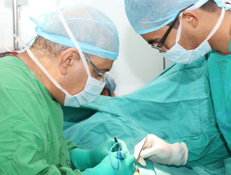 Surgeons working on a patient in operation room