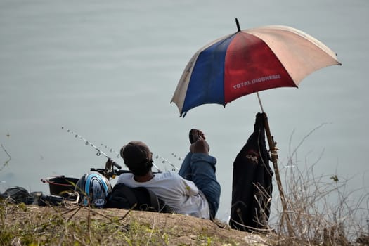 Padalarang, Indonesia - August 1, 2014: Man get fishing in Saguling lake Padalarang, West Java-Indonesia.