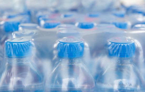 Rows of water bottles in plastic wrap