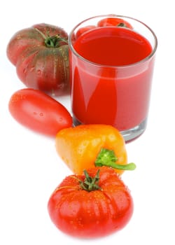 Freshly Squeezed Tomato Juice with Various Tomatoes and Orange Bell Pepper isolated on White background