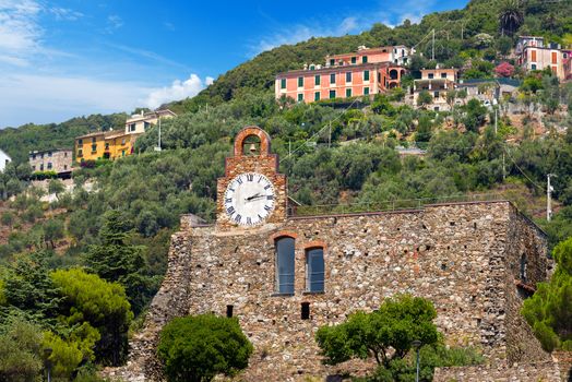 Ruins of the castle of Bonassola (XVI century) and the recent public clock. Bonassola, ancient Ligurian village, La Spezia, Italy