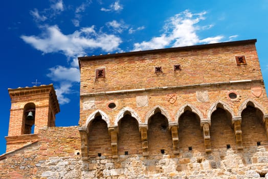 Detail of ancient Porta San Giovanni (1262), south entrance of the city of San Gimignano, Siena, Tuscany, Italy