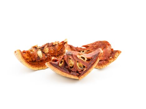 dried bael fruit on white background