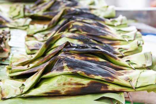 steamed fish with curry paste in banana leaves wrap (thai food)