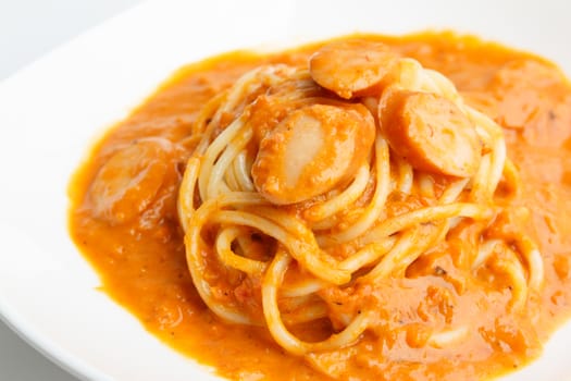 Spaghetti with sausage and tomato cream sauce