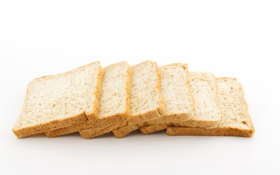 Sliced whole wheat bread on white background