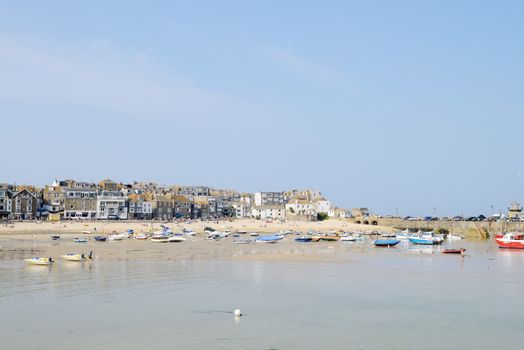 Fishing boats on the beach in St Ives Cornwall on a sunny summer day