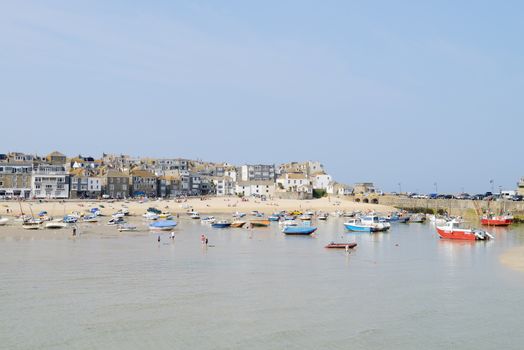St Ives in Cornwall on a sunny day showing fishing boats in the harbour