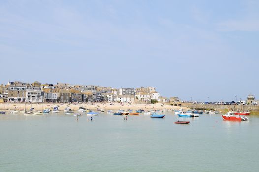 St Ives in Cornwall, England. On a sunny day in the summer showing boats in sea.
