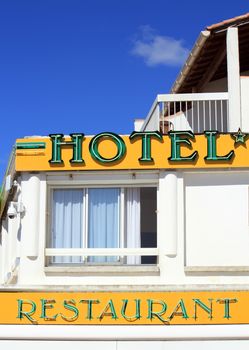 Colorful hotel and restaurant building by beautiful day