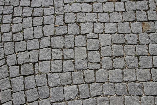 Close up on granite cobblestoned pavement background