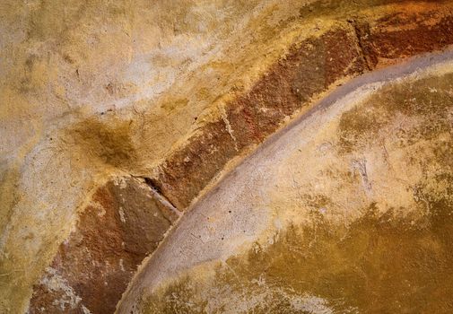 abstract background or texture arc in old ocher plaster