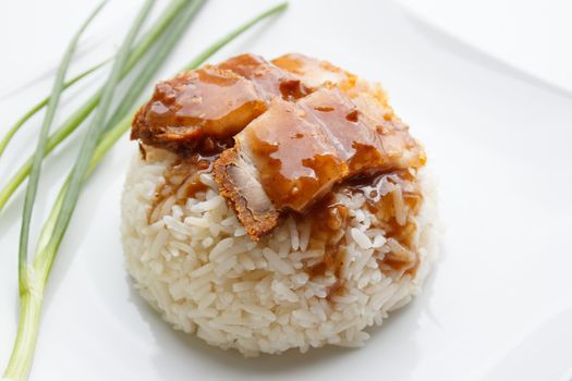 crispy pork with rice and Spring Onion isolated on white background