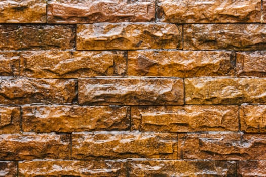 water fall on old brown brick wall background