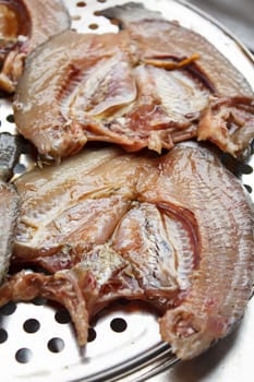 split in raw Nile tilapia, Mango fish, Nilotica to fry in a hot pan.